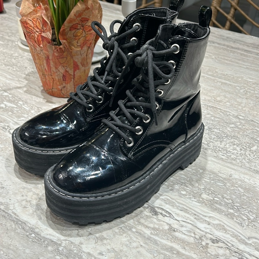 Black leather combat platform boots